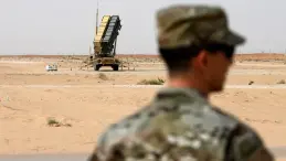 DoH Abu Dhabi logo and a hospital ward interior