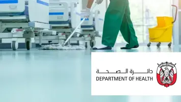 DoH Abu Dhabi logo and a hospital ward interior