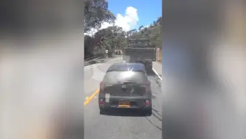 Aftermath of a bomb explosion on a busy highway in Colombia.
