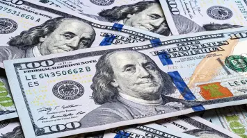 الدولار يتراجع بعد تصريحات باول بشأن خفض الفائدة