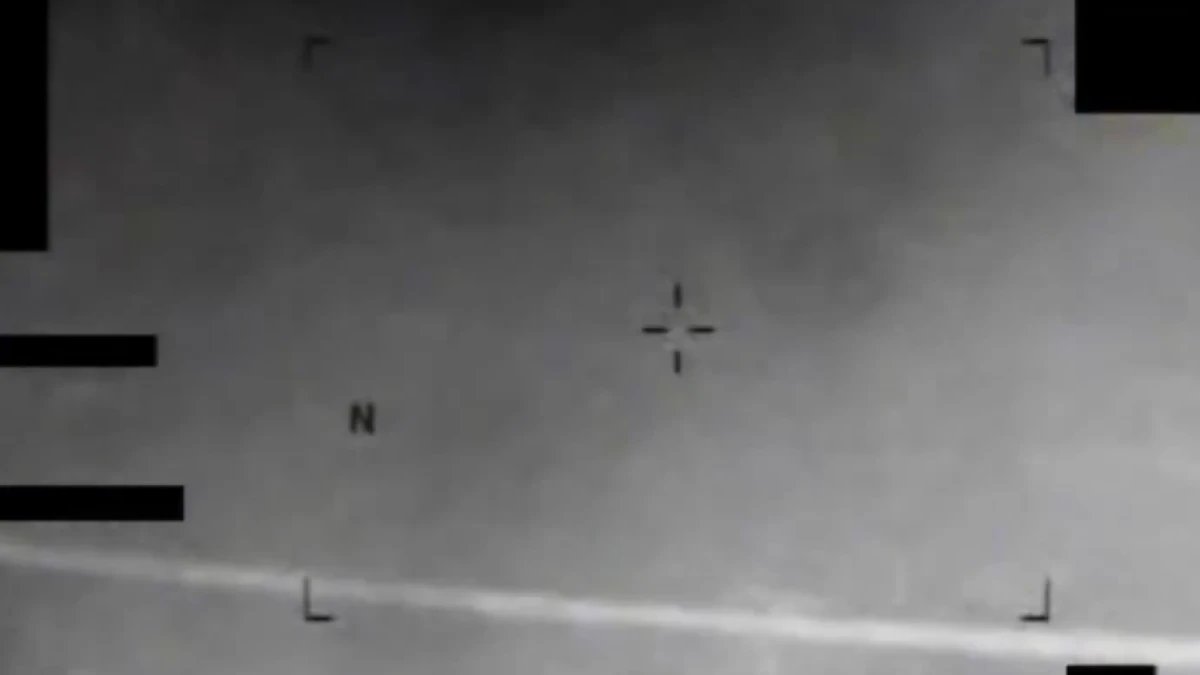 Infrared image showing an eight-pointed star-like object in the sky.