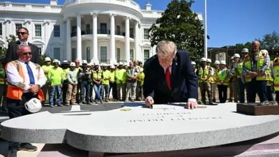 Donald Trump signing granite block for helicopter pad at White House