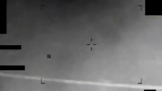 Infrared image showing an eight-pointed star-like object in the sky.