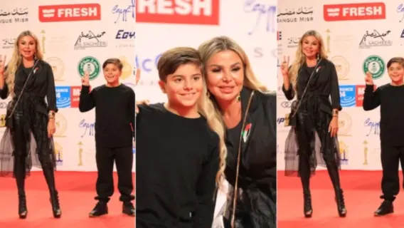 رزان مغربي وابنها يرفعان علامة النصر دعماً لفلسطين في مهرجان القاهرة السينمائي