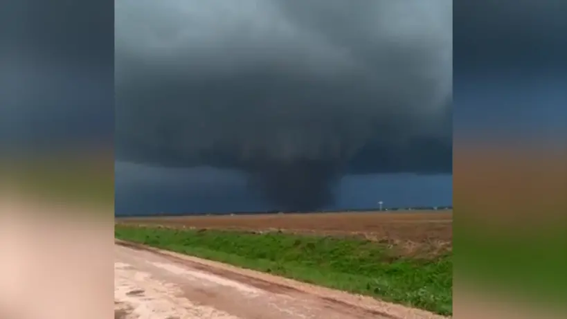 A large tornado over a rural landscape in Oklahoma.