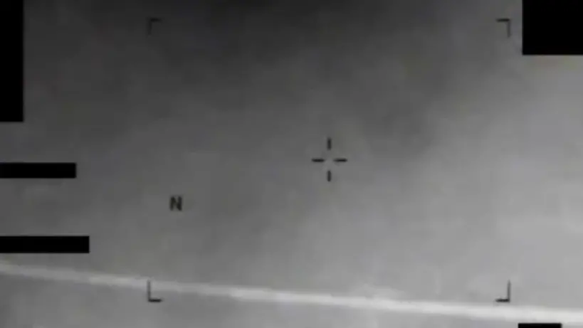 Infrared image showing an eight-pointed star-like object in the sky.